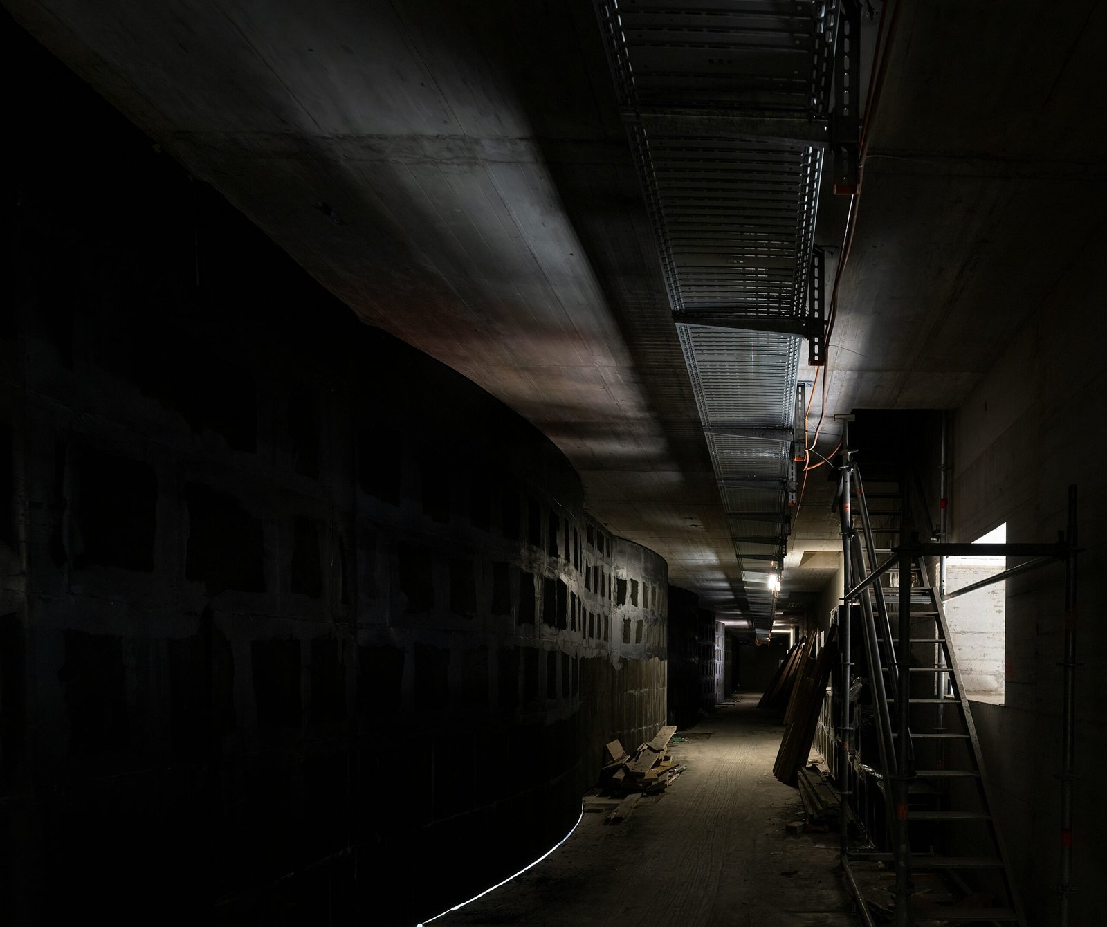 black and white tunnel with stairs